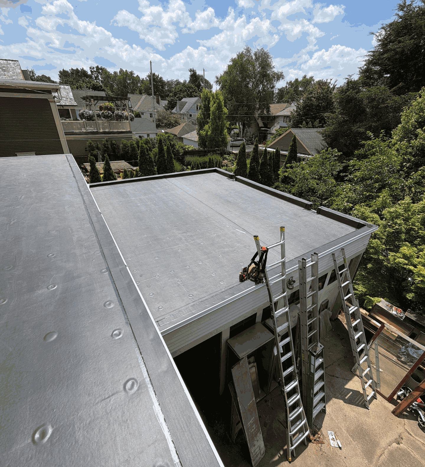 Newly installed EPDM rubber flat roof on a garage