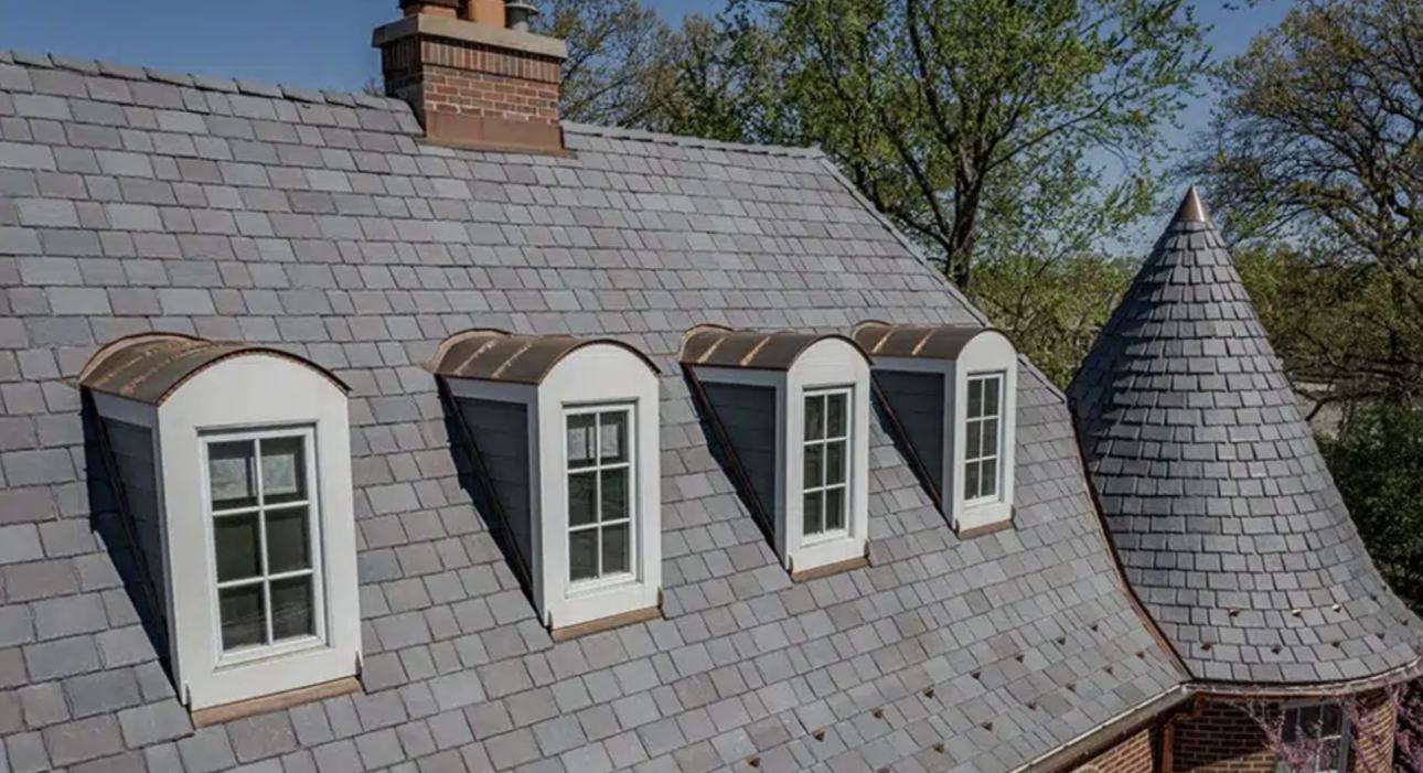 Slate roof with copper-capped dormers and a slate turret