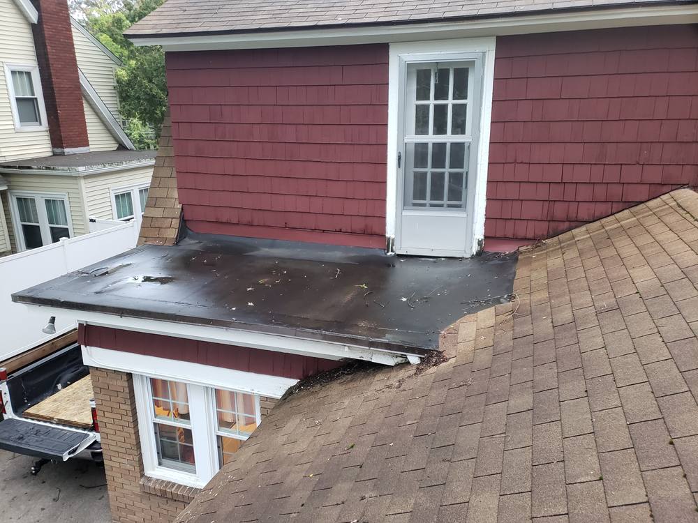 EPDM Flat Roof and Door-to-Window Conversion in West Michigan — photo 1 of 13