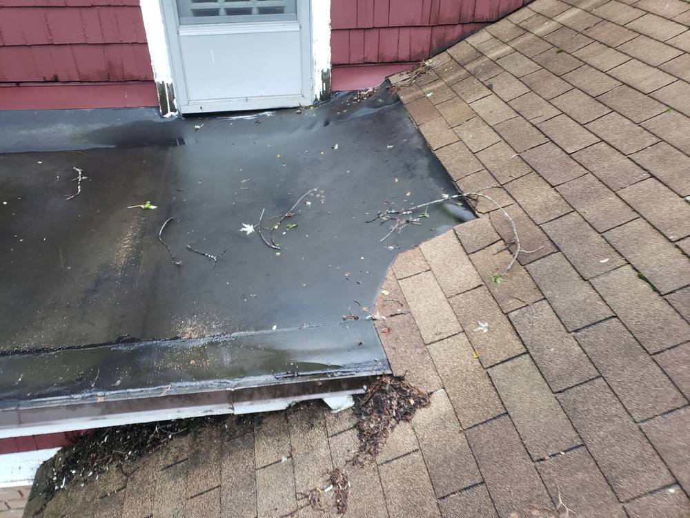 EPDM Flat Roof and Door-to-Window Conversion in West Michigan — photo 2 of 13