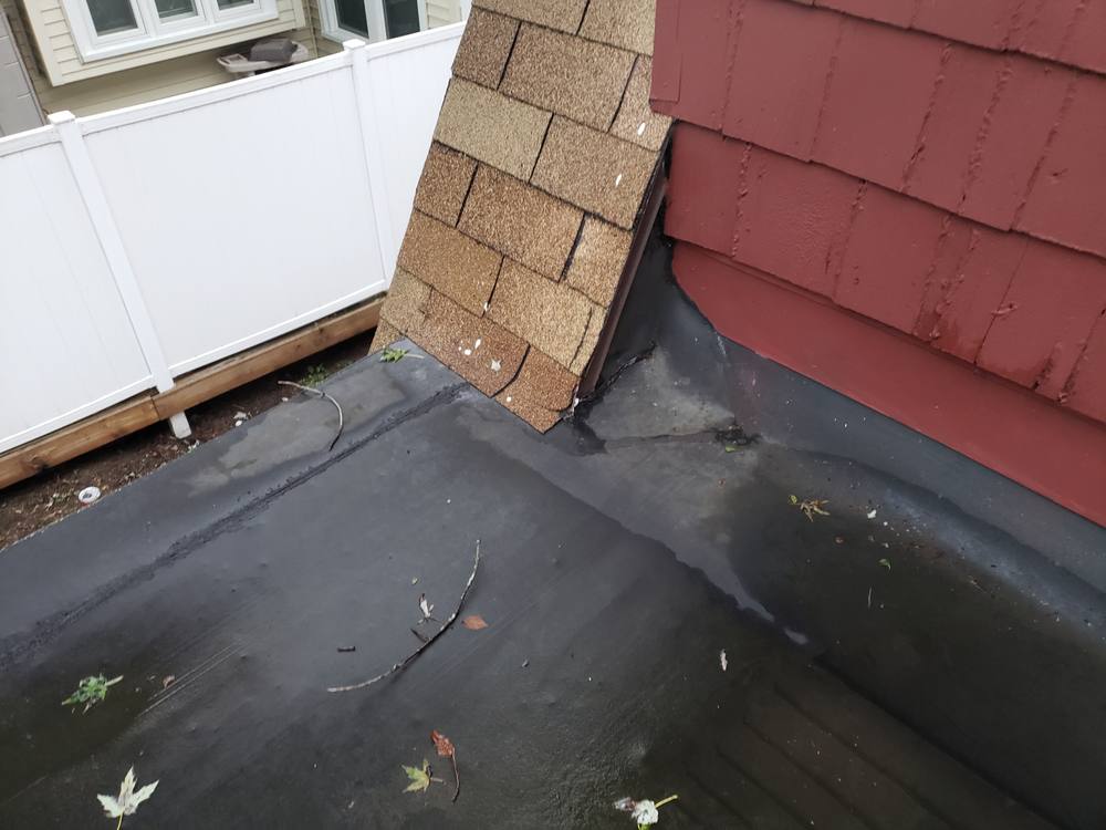 EPDM Flat Roof and Door-to-Window Conversion in West Michigan — photo 3 of 13