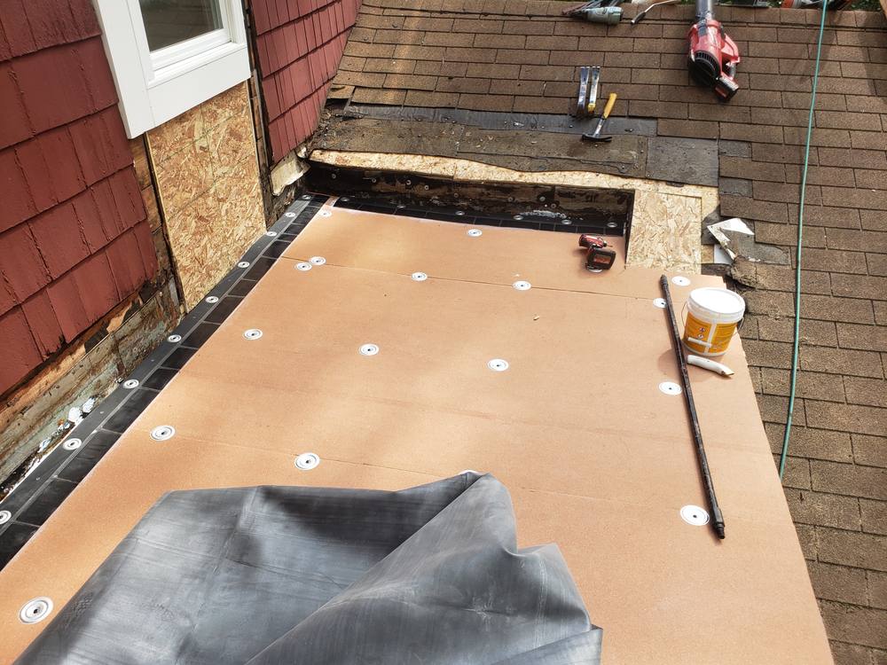 EPDM Flat Roof and Door-to-Window Conversion in West Michigan — photo 9 of 13