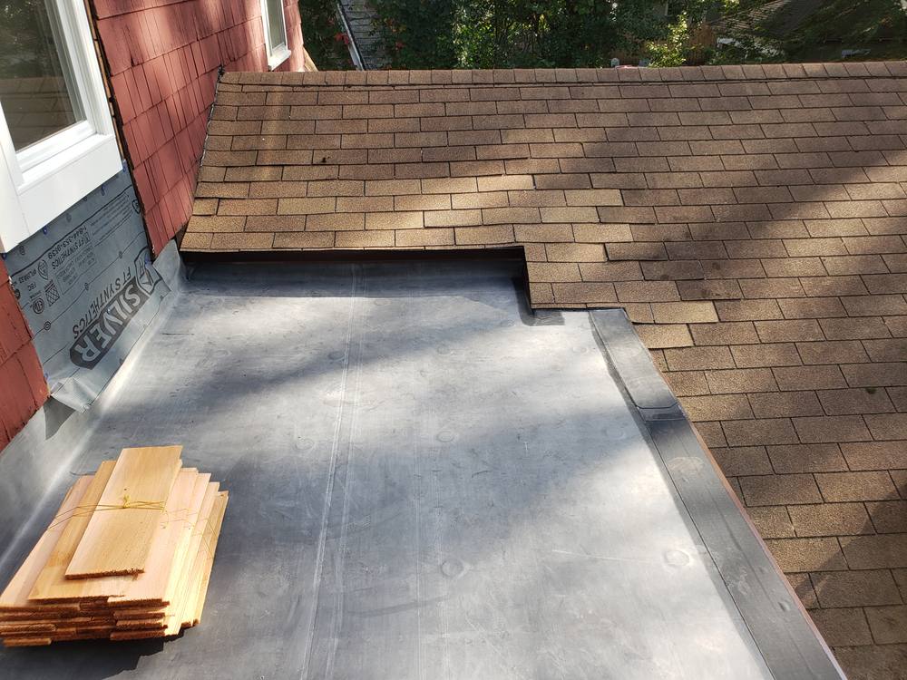 EPDM Flat Roof and Door-to-Window Conversion in West Michigan — photo 12 of 13