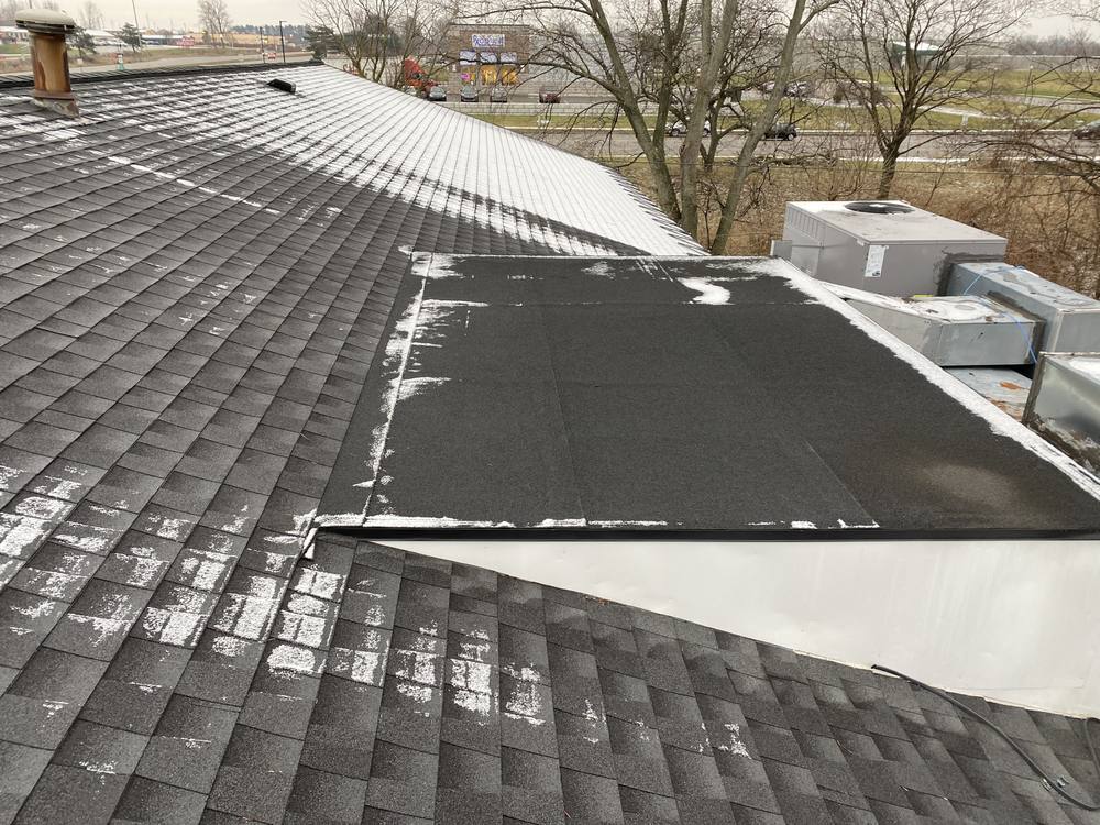 EPDM Flat Section on a Shingle Roof in West Michigan — photo 1 of 7