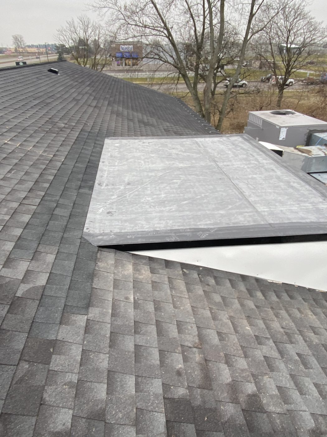 EPDM Flat Section on a Shingle Roof in West Michigan
